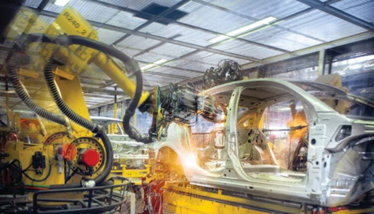 A Hytrel dress pack (corrugated tube) contains cabling and wires, keeping them protected and free from abrasion as an automotive welding robot moves along multiple axes.